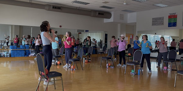 Hillary Swift, left, leads a class of the Silver Sneakers program, a fitness program for people 65 years old and older