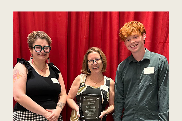 Isa Obradovich, Stephanie Danker, and Ryan Jeansonne pose with Danker's ASG Outstanding Professor plaque