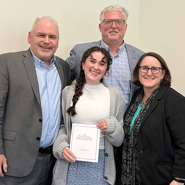 Becca Borton '25 at the National Fellowships Reception at the Armstrong Student Center in April, where Miami recognizes all fellowship winners and semifinalists from the academic year. Borton is surrounded by Karla Guinigundo and mentors John Forren, left, and Thomas Misco (submitted photo).