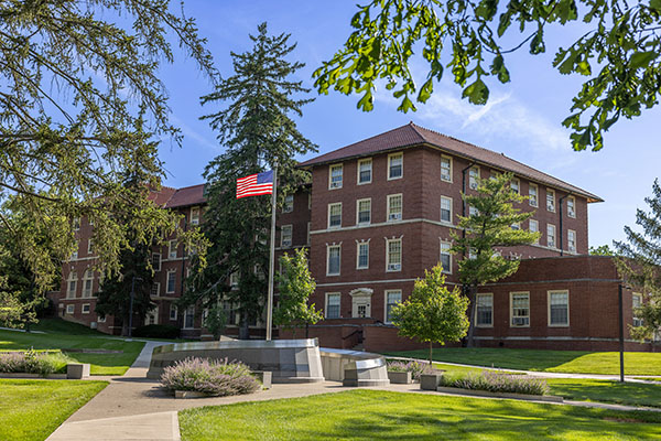 View of the west side of Wells hall and the Veterans memorial 