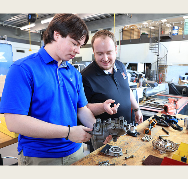 Chris Tsai and Clayton Cooper in the high bay lab