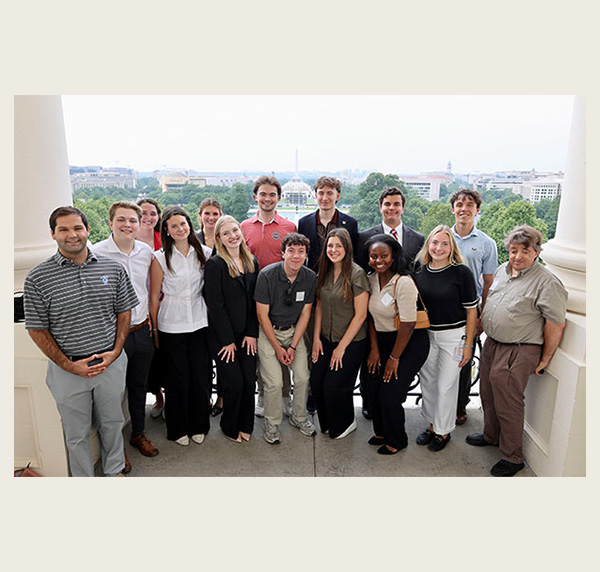 Inside Washington program, summer 2026,  participants pose on the Speakers Balcony in Washington, D.C.  