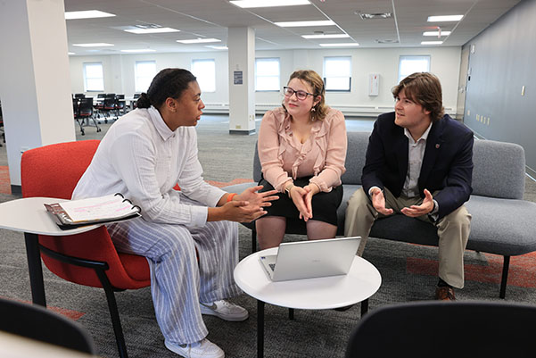 Miami University students Davia Poythress, left, speaks during a recent internship experience at Cleveland Clinic.