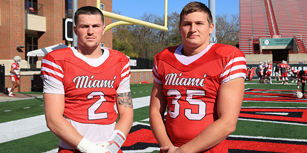 Jackson Pons, left, and Tyler Dikos of the Miami University football team