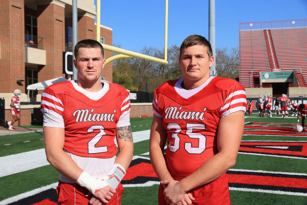 Jackson Pons, left, and Tyler Dikos of the Miami University football team