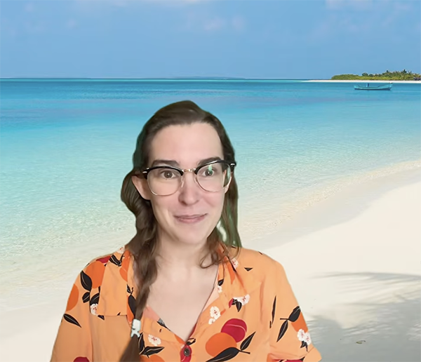 Nessie O'Neil and a backdrop of a sandy beach and ocean