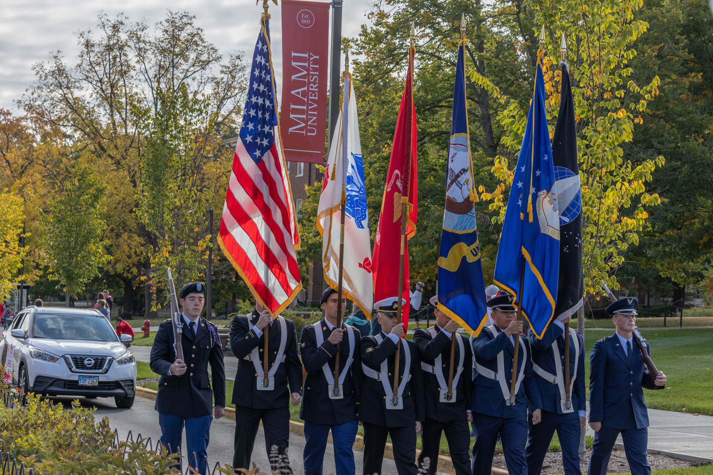 An ROTC color guard marches at the 2023 Homecoming Parade.