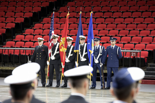  A ROTC color guard stands at attention during a commencement ceremony in Millett Hall.