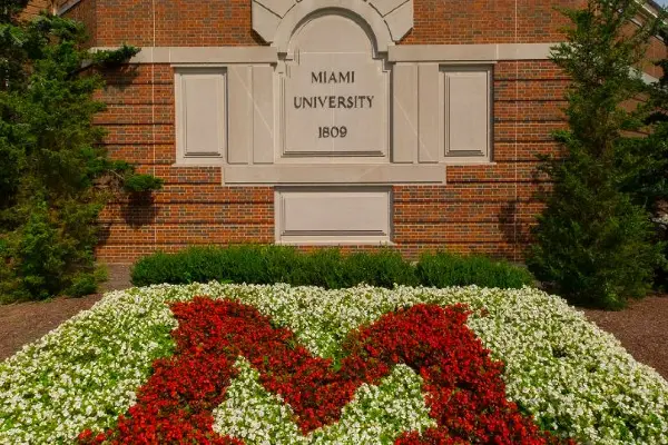 pearson hall  with block m in front made of flowers