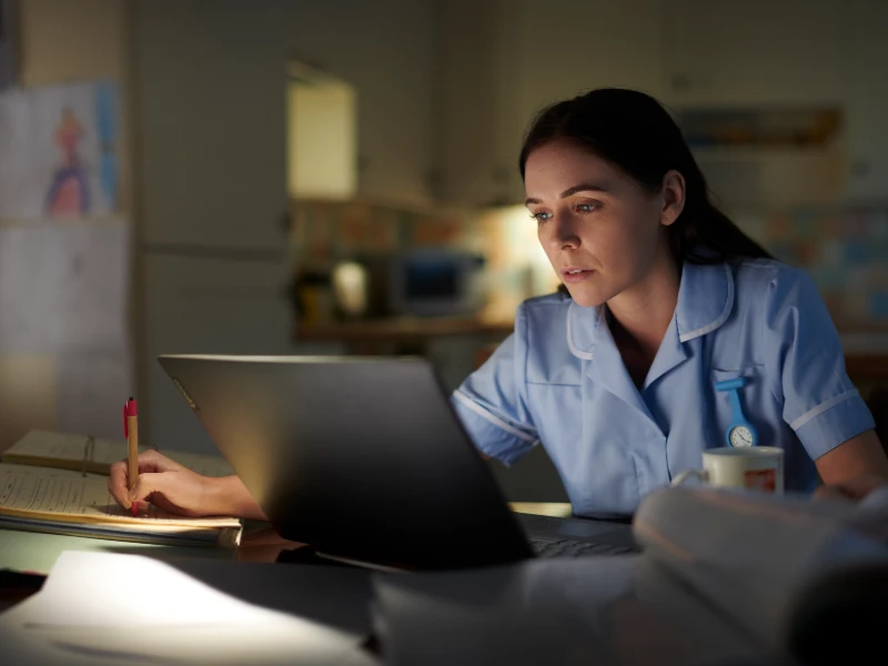 nursing student working at computer 
