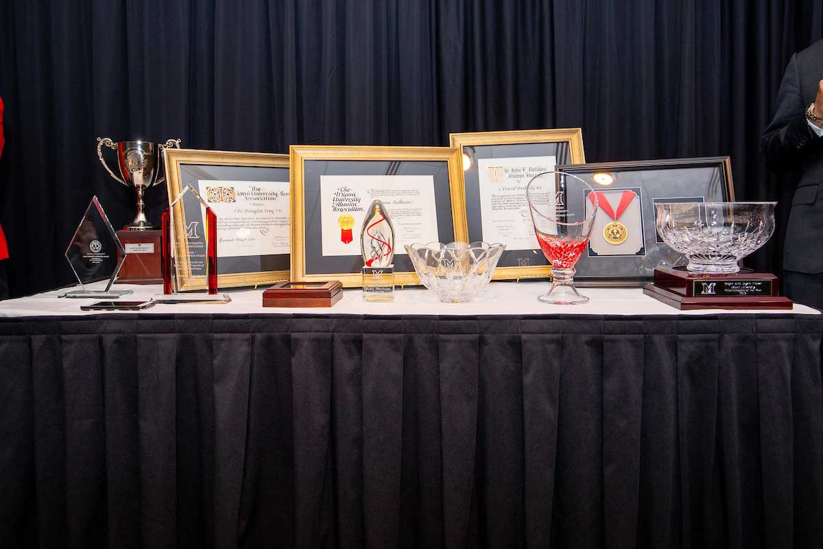 various trophies and plaques on a table