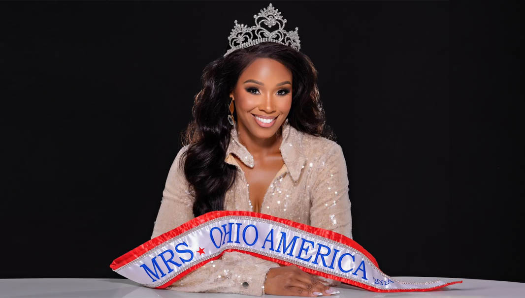 Anedra Million wearing a white satin sash and crown of Mrs. America