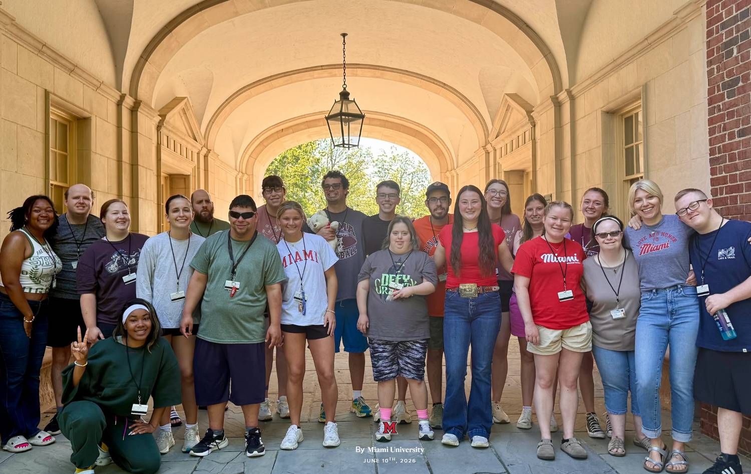 Students gathered for a group photo under the Upham Hall arch