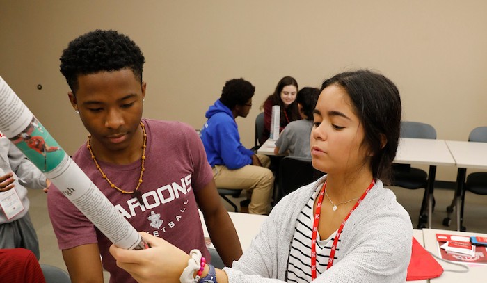 Two high school students in the bridges program working on an engineering project in a classroom