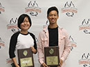 Chen Li and Antonio Williams holding their C. Eugene Bennett Awards