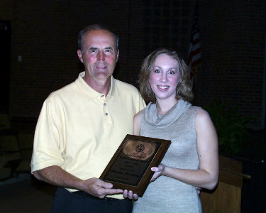 W. Lynn Darbyshire presenting an award to a student.