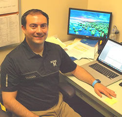 Dr. Jeff Kuzneoff at his desk