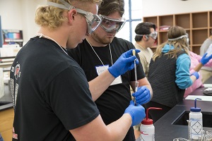 Two male students working on a lab at Chemistry education day at Miami Middletown