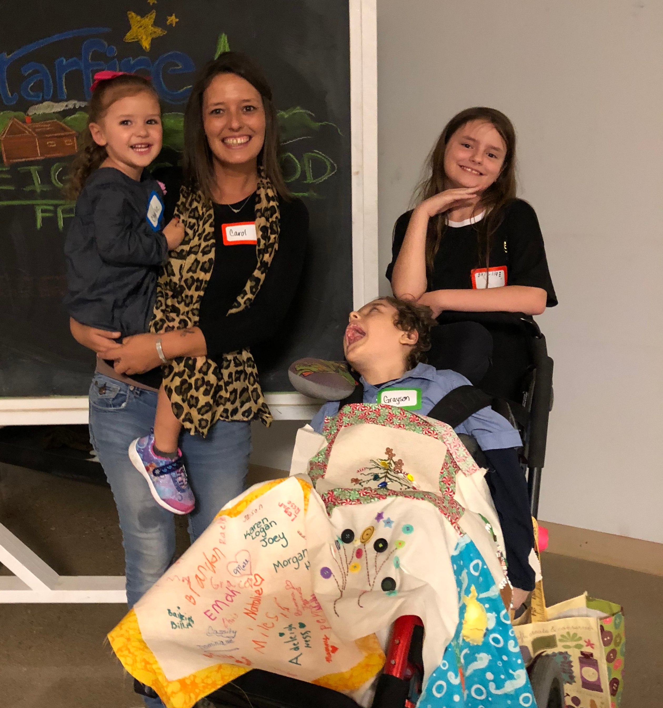 Photo of Carol Combs with her three children.