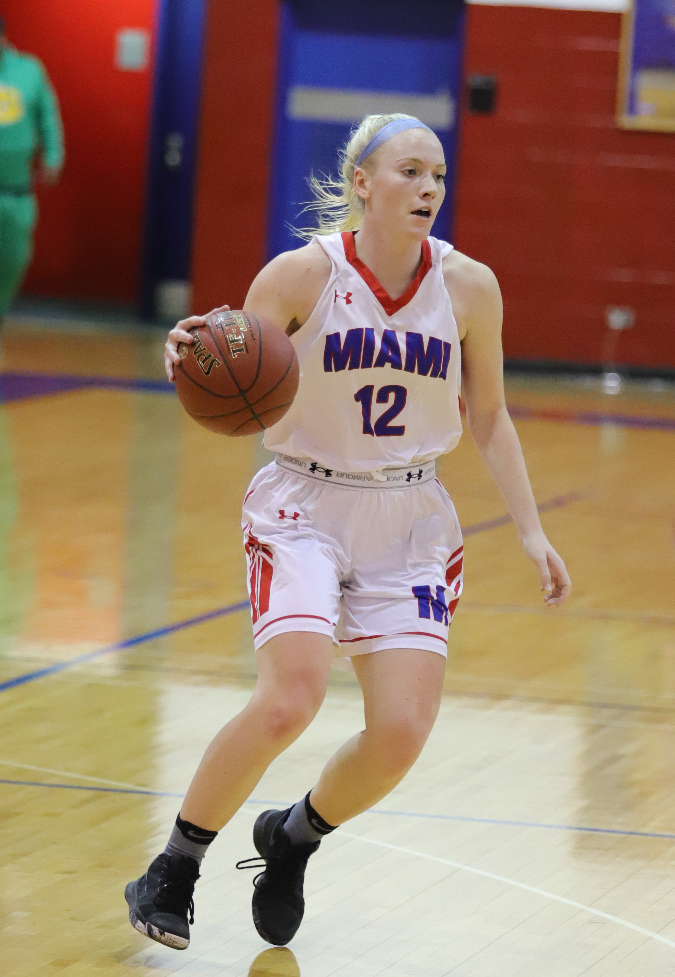 Adrianna playing basketball