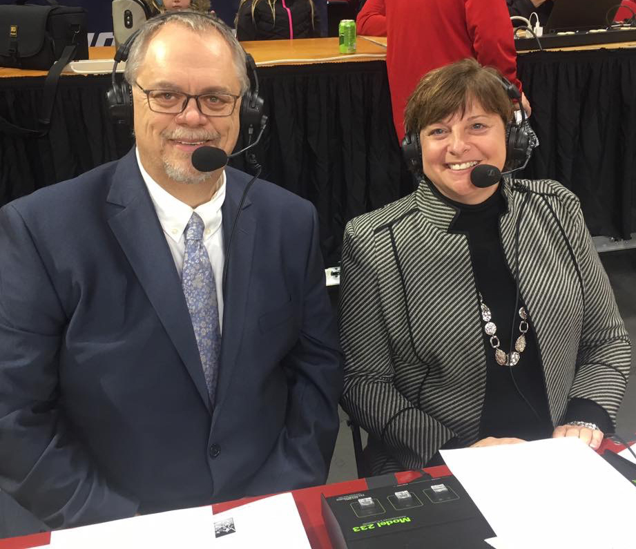 Steve Baker announcing a game with a woman.