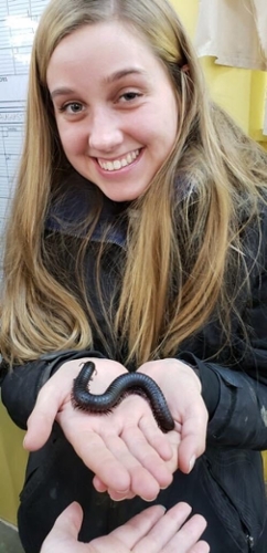 Saige Sparks holding a worm