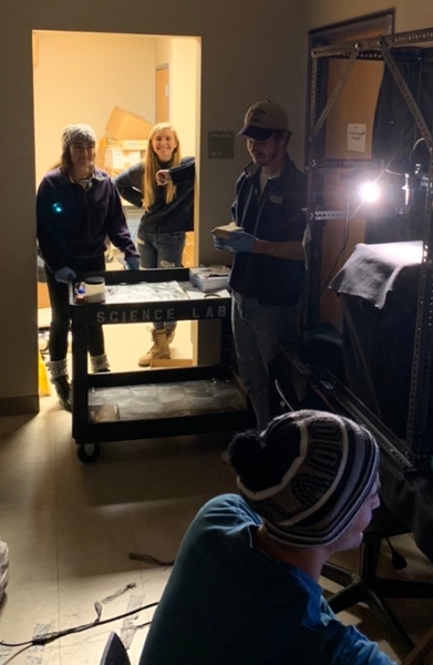 Jordan Vest Claudia Dawson Traister Oglesbee Carter Lindeman working with a spectroradiometer at the Miami University Hamilton Campus.