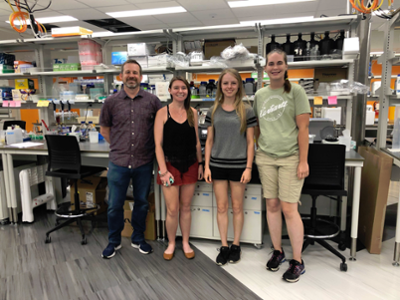 (Left to right) Matt Saxton, EEEB Ph.D. candidate Carly Prochazka, and Applied Biology majors Helena Hitch and Emma Jones