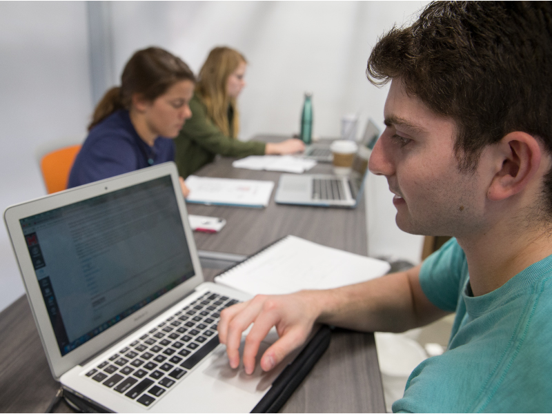 A student working on his laptop