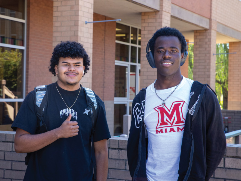 2 male students at Miami Regionals smiling at the camera