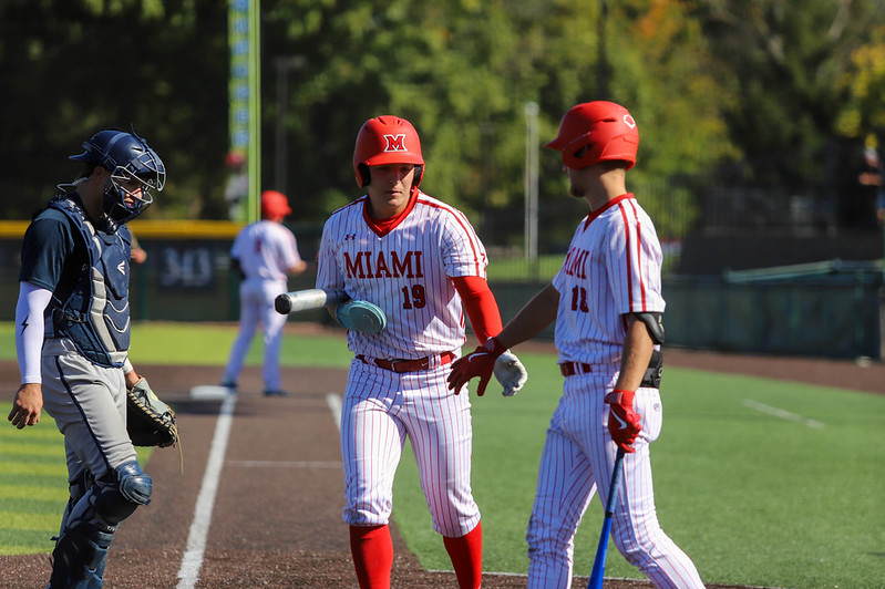 ThunderHawk baseball players high five after an at bat.