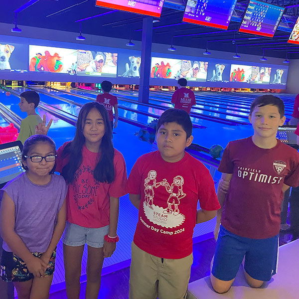 A group of campers bowling