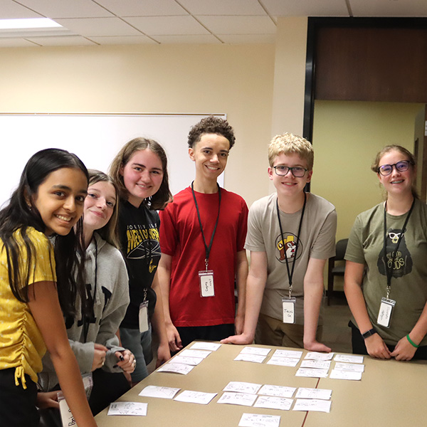 A group of teens solving a problem together
