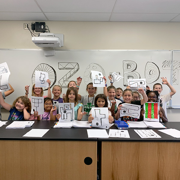 A group of campers with ozobots