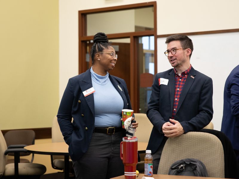 Employer and Miami faculty talking.
