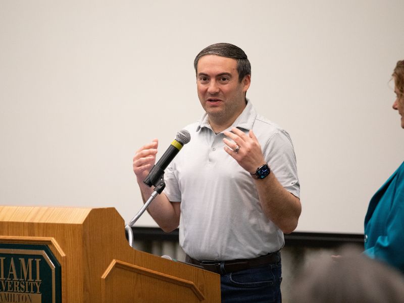 Miami faculty giving a presentation.