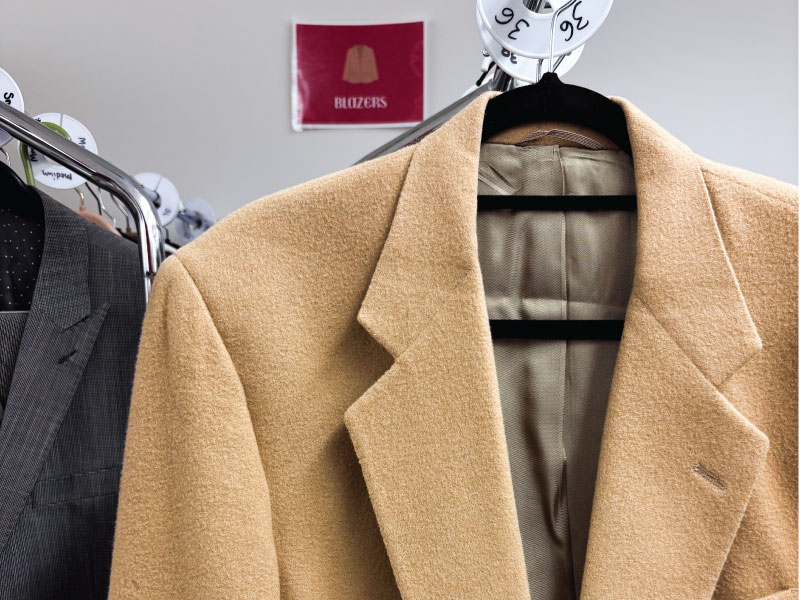 Blazers hanging up on hangers
