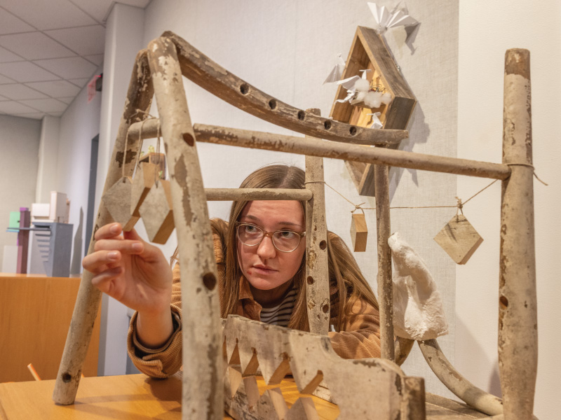 Student creating an art project as part of a humanities course at Miami University.