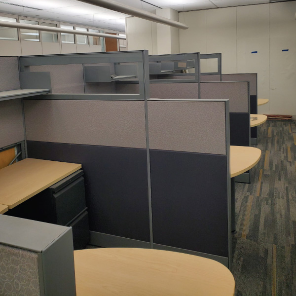 Cubicle desks in an open area.  