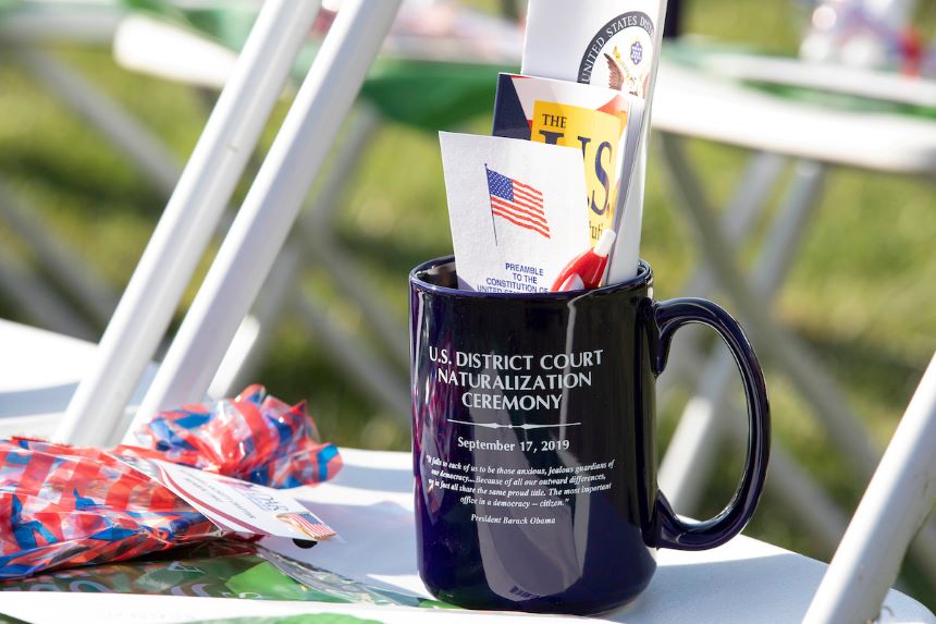 Coffee mug and flag on chair for the naturalization ceremony.