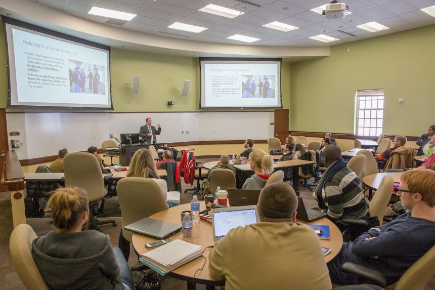 Professor lectures a criminal justice class. 