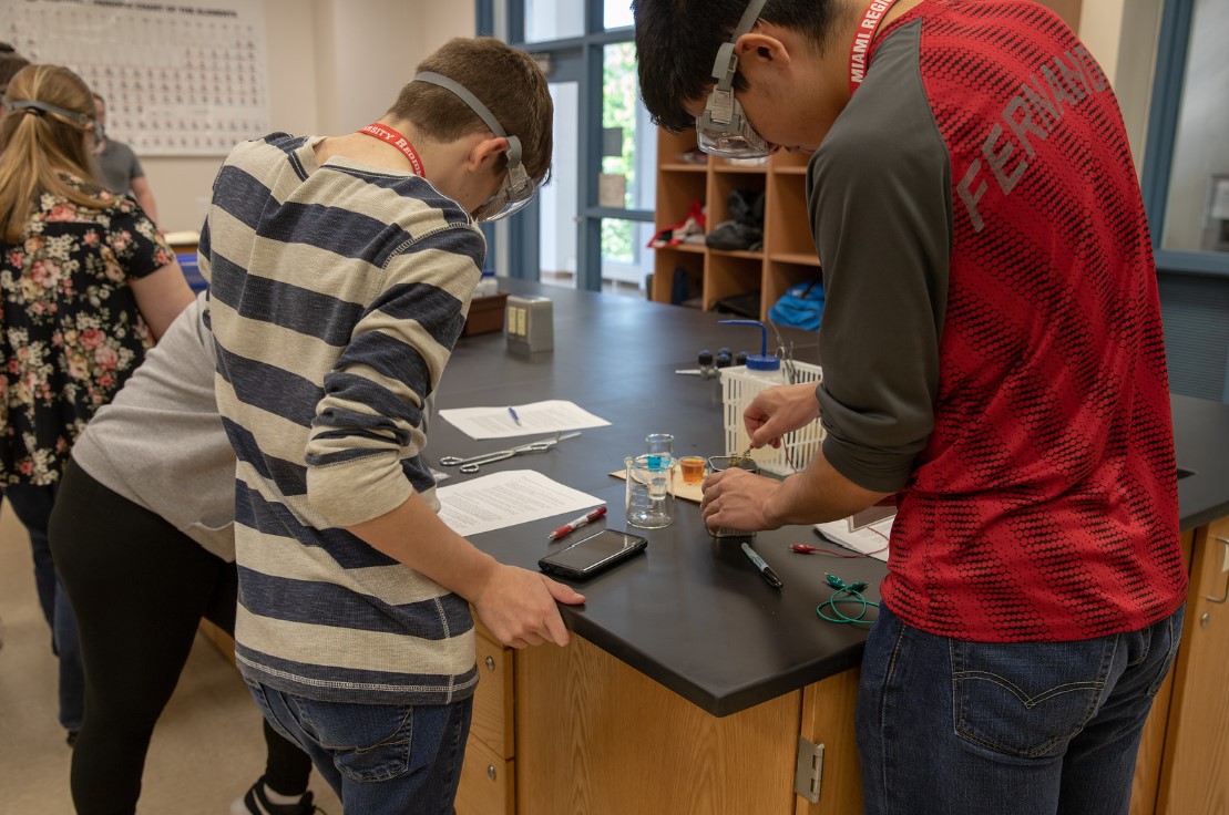Students work on a chemistry project during career day 2019.