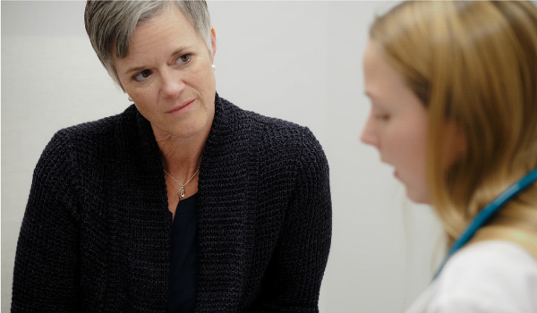 Brooke Flinders associate professor and dean of Nursing, working with a nursing student.