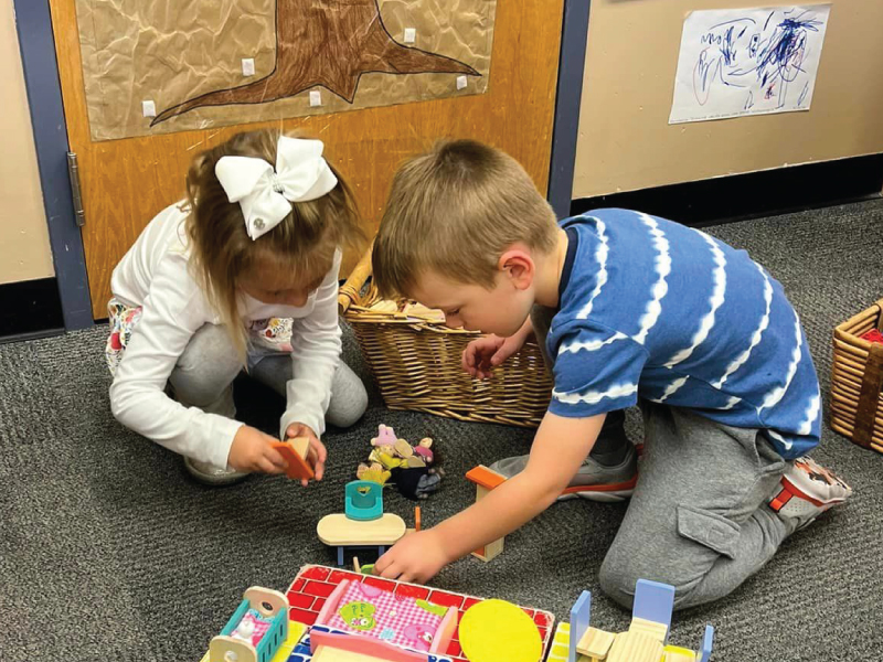 2 children playing with toys at Campus Kids located on Miami's Hamilton Campus.