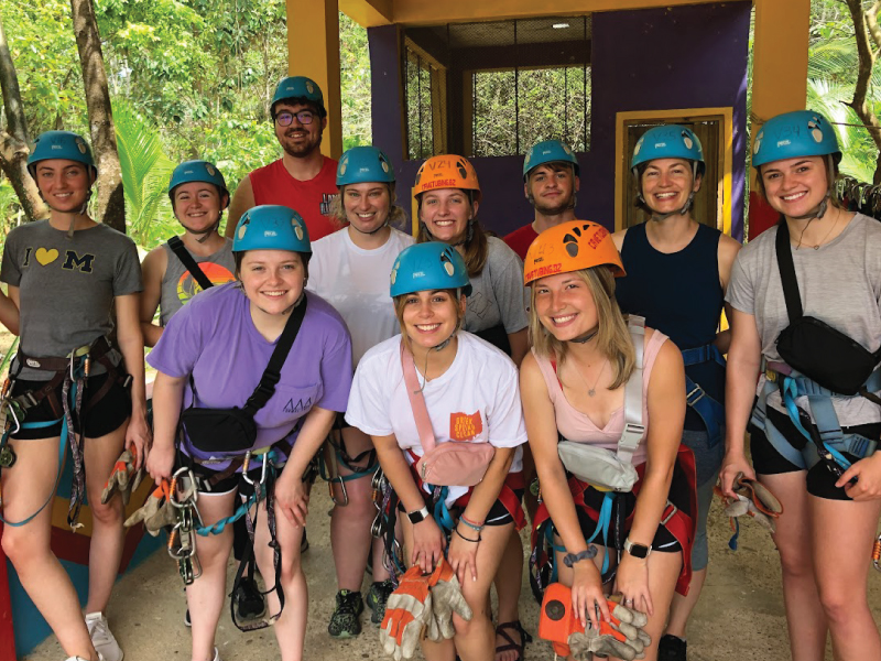 Students going ziplining.