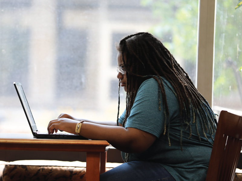 A student working on their laptop.