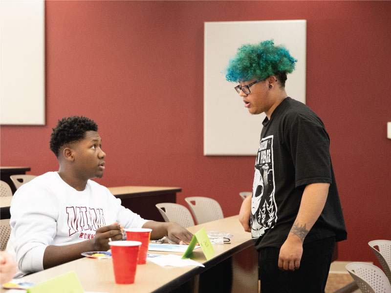 Micheal Eheart discussing with a student during the painting exercise.