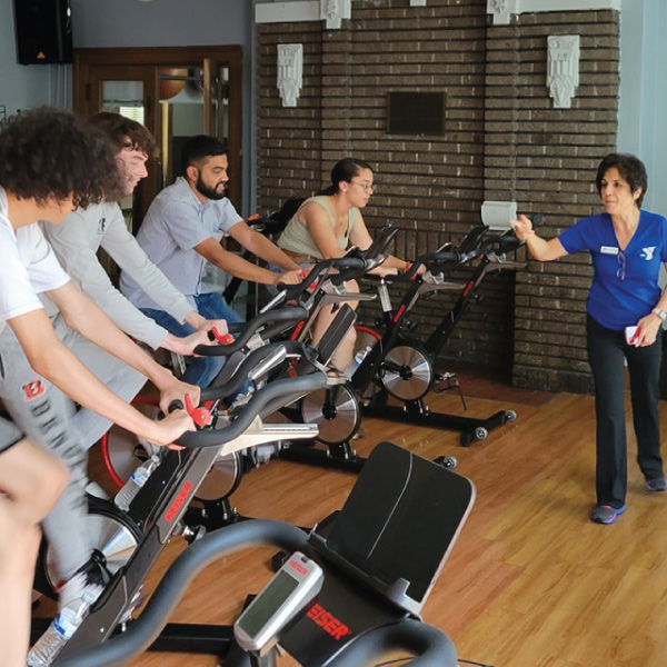 Upward Bound students taking a cycling class at the YMCA.