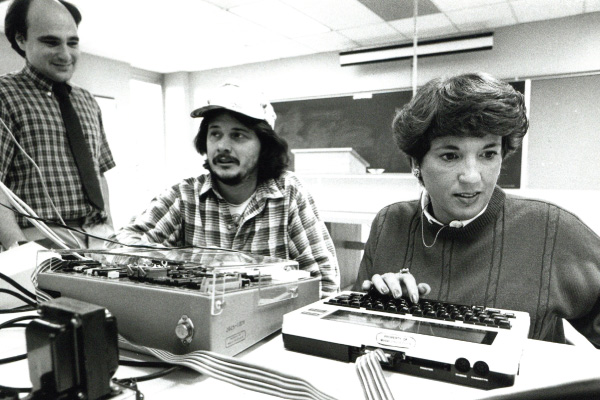 Black and white photo of Engineering technology students in a lab in 1988.