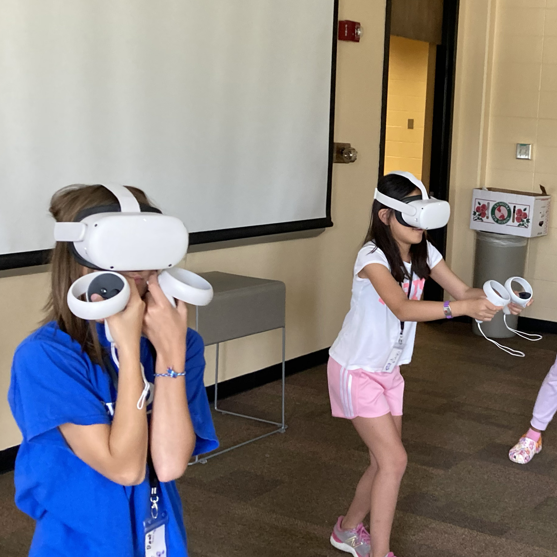 STEAM Studio campers playing a game with VR headsets